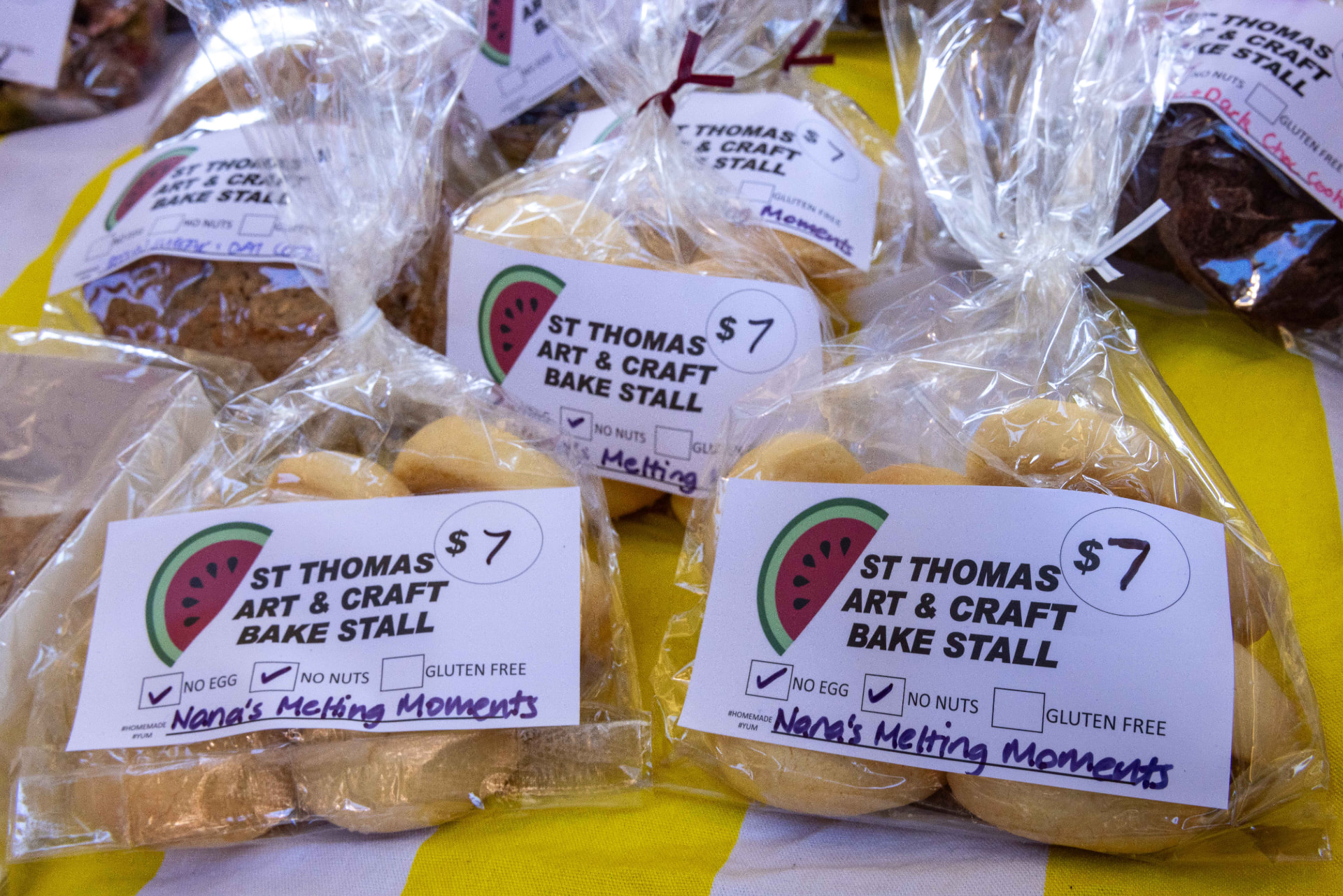 Bags of home baked melting moments labelled St Thomas Art & Craft Bake Stall