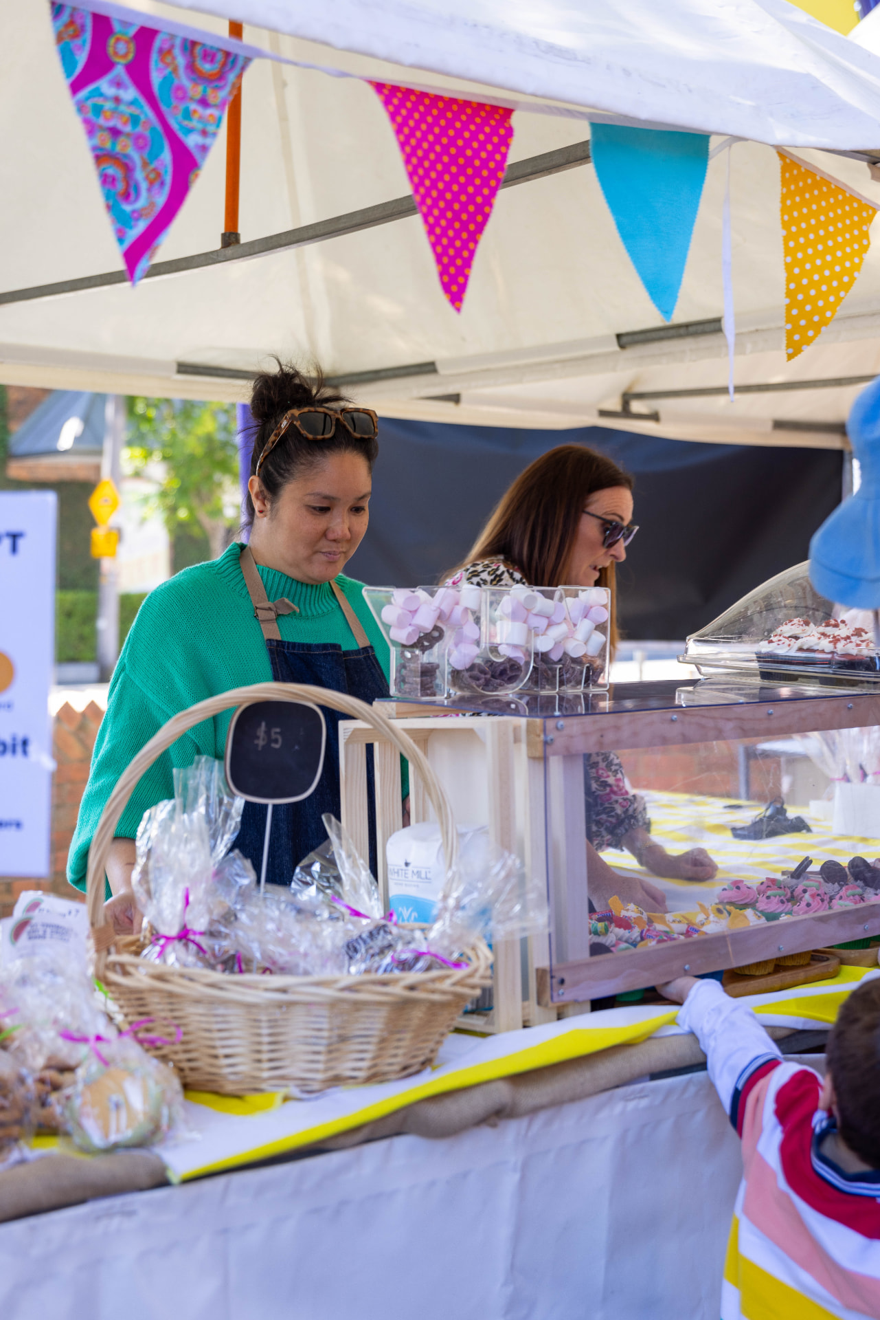 Cupcakes and treats on display at the bake stall