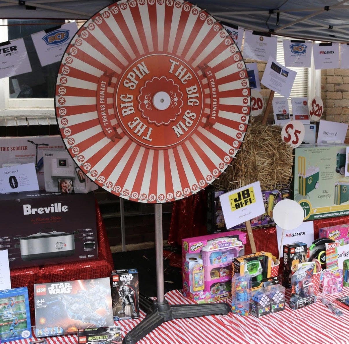 The Big Spin prize wheel surrounded by toys, games and electronics