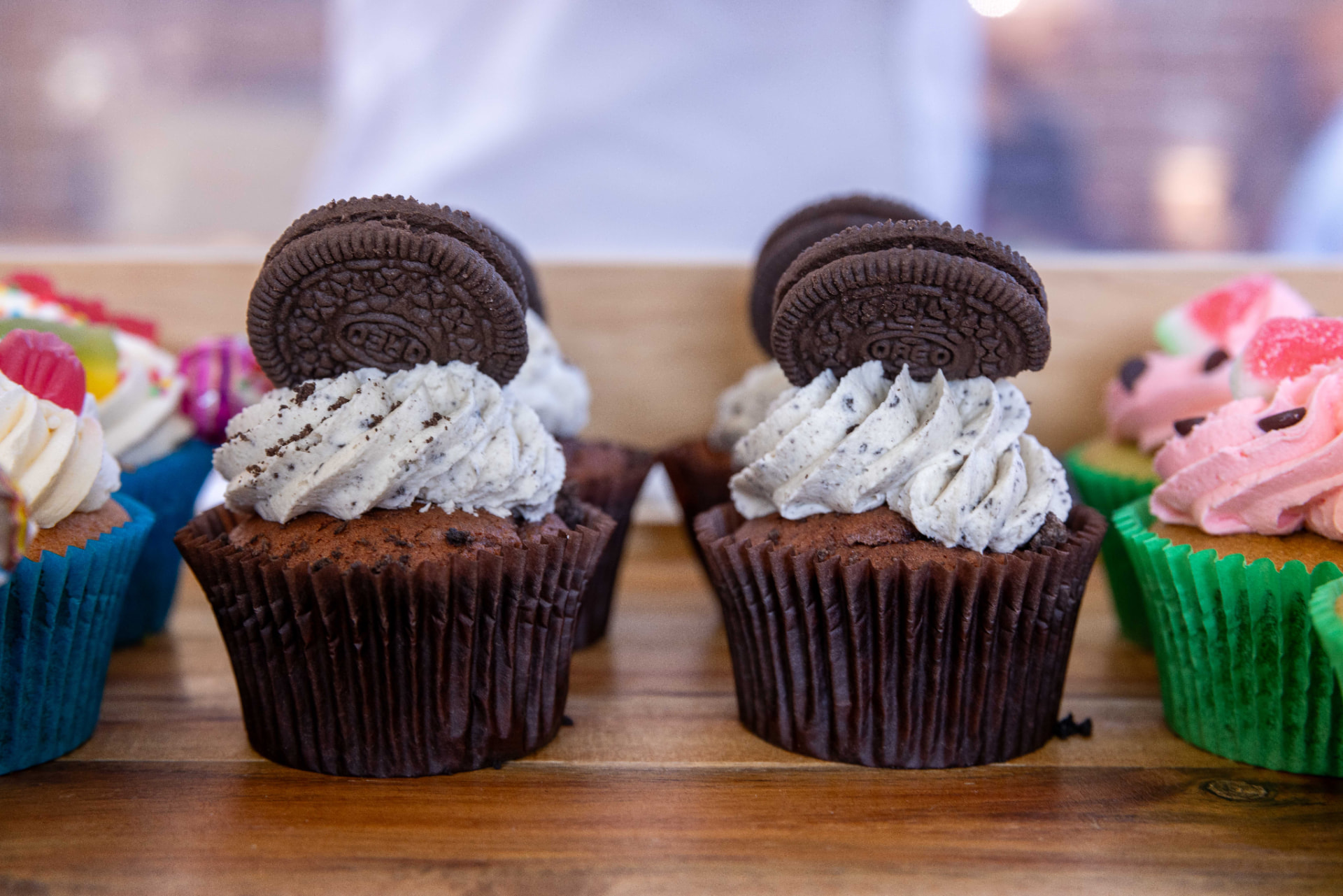Cookies and cream cupcakes on a wooden board