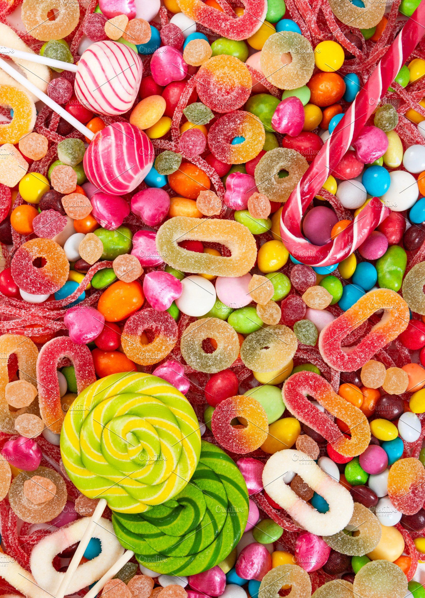 A vibrant mix of colourful lollipops, gummies and candy